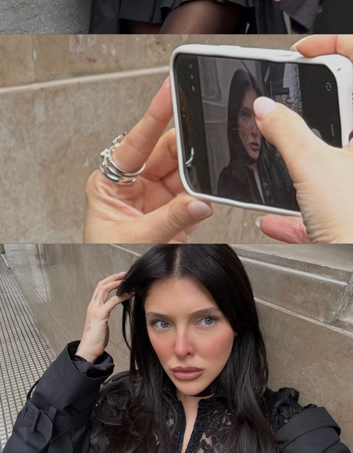 Hands framing a portrait on a phone screen between street shots