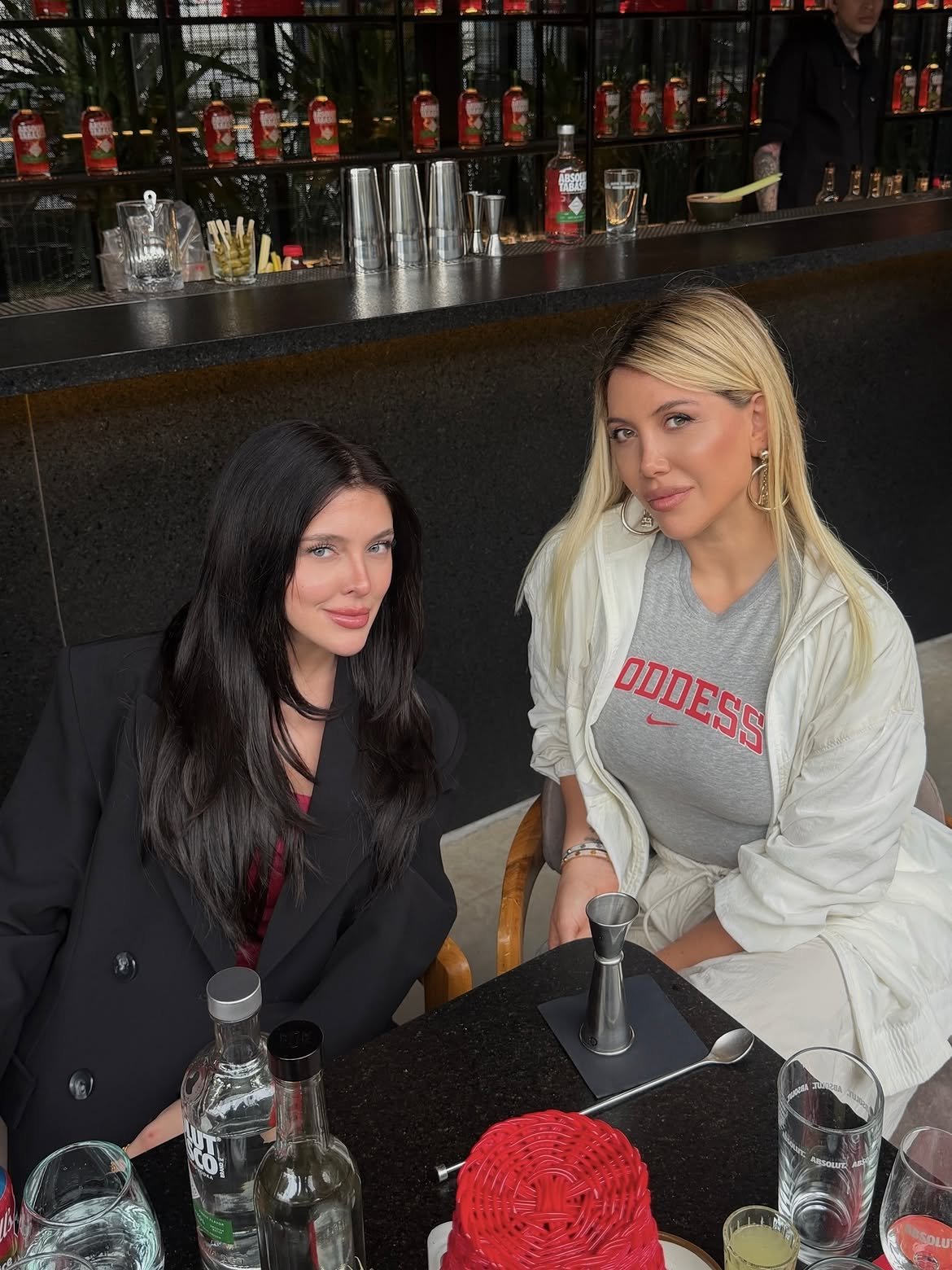 Two women at an Absolut Tabasco bar table