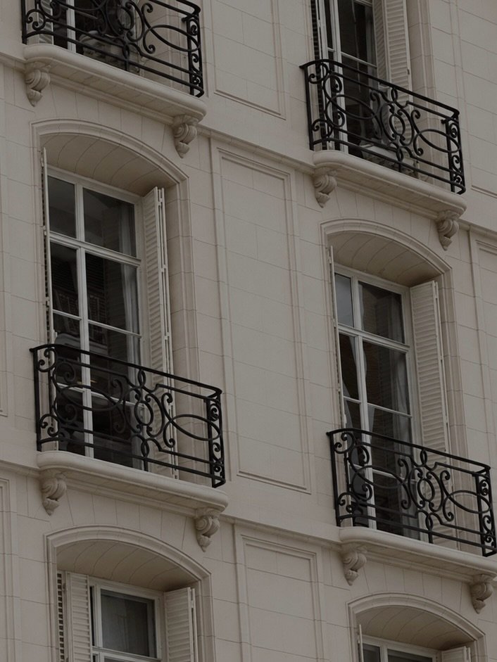 Parisian-style façade with wrought-iron balconies