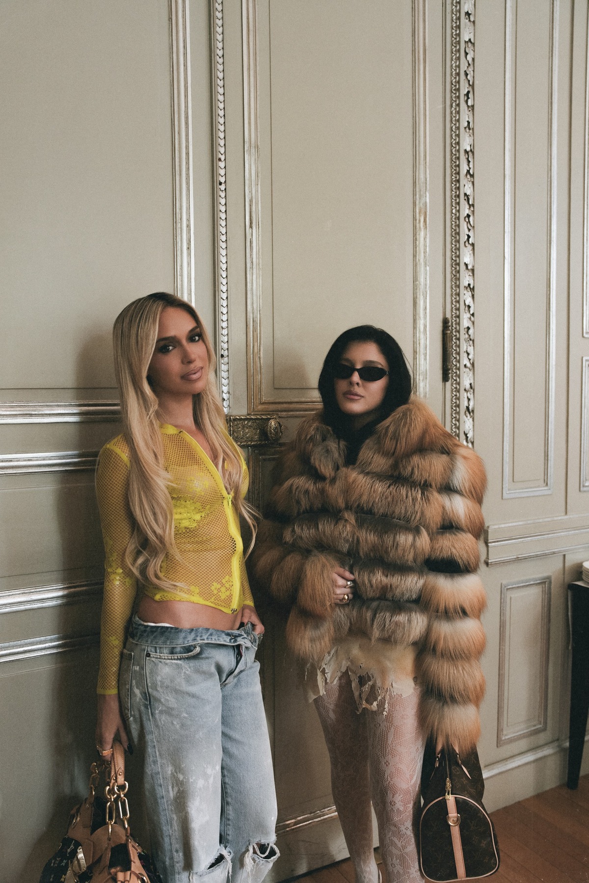 Bad Gyal and Sofía Gonet full length with vintage Louis Vuitton bags